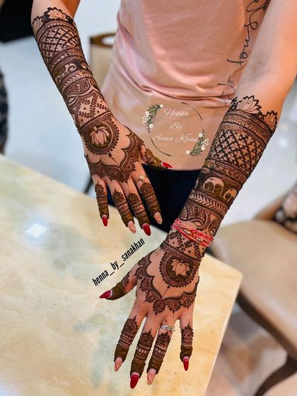 Another angle of the full bridal design, showing the beautiful flow from the lotus on the palm to the elephants and jaali work on the arms.