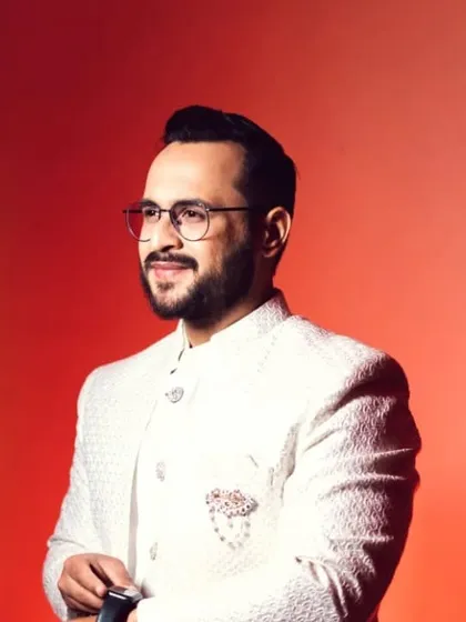 A professionally lit portrait of the groom. My makeup techniques ensure you look just as good under studio lights as you do in natural daylight.