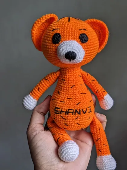 A full-length view of the personalized tiger doll.