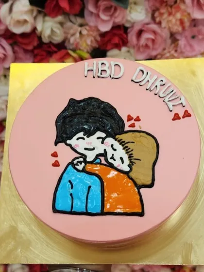 A warm hug in cake form. This adorable hand-drawn design on a pink frosted cake is perfect for celebrating a loved one's birthday. I can customize the message and drawing to make it a truly personal gift.