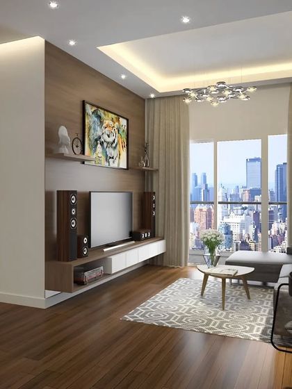 A compact apartment living room with a view of the city. The design uses a simple wooden media unit and a comfortable L-shaped sofa to maximize space without sacrificing style or comfort.