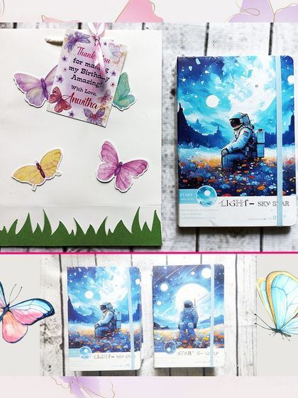 A lovely pairing of a butterfly-themed paper bag with a beautiful space-themed notebook, perfect for older kids who appreciate artistic designs.