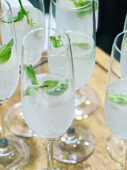 Refreshing mint and lime coolers served in elegant champagne flutes, a perfect palate cleanser between courses.