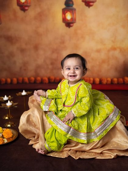 A happy, playful moment captured during the Diwali mini session. Her smile shows she's having a great time.