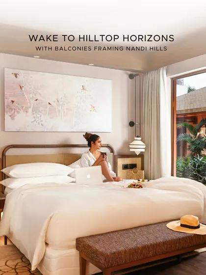 Wake up to hilltop horizons. Our suites are designed for serene mornings, where you can enjoy a private breakfast in bed while gazing out at the natural beauty from your balcony.