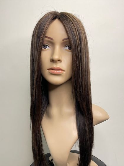 A full view of a long, highlighted silk wig. This piece combines the most natural-looking scalp with beautiful, high-quality hair for a truly premium experience.