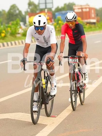 Two elite riders, working together in a breakaway.