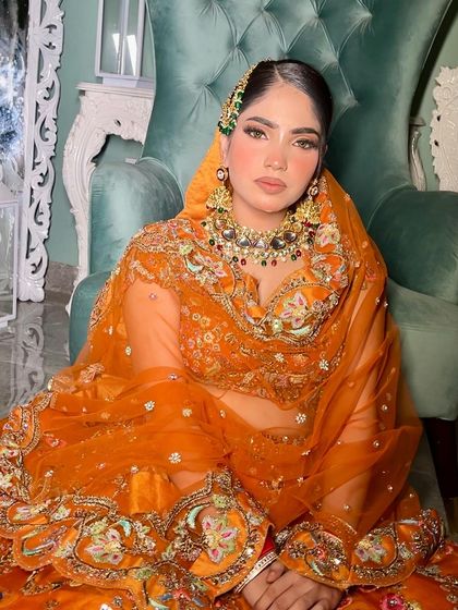 This entire look, from the detailed lehenga to the layered jewelry, creates a breathtaking image for an autumn or winter bride.