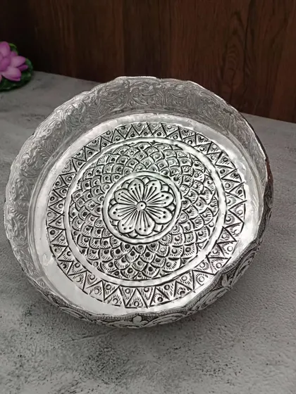 A duplicate image of the intricate floral urli, emphasizing its beautiful design.