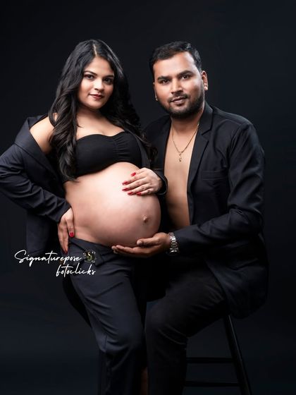 This shot captures the connection between the couple, both styled in modern black for a cohesive and chic look.