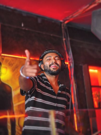 A playful point to someone in the crowd. These small interactions make a big difference in making people feel seen and part of the show.