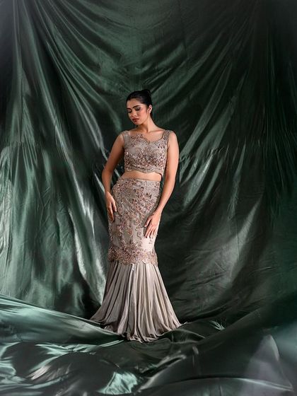 Another angle of the mermaid gown, showcasing the silhouette and elegant posing.