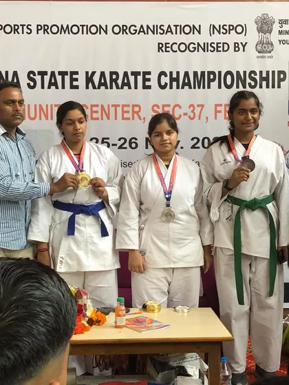 My female fighters showing their medals at the Haryana State Karate Championship. They are strong, skilled, and ready for any challenge.