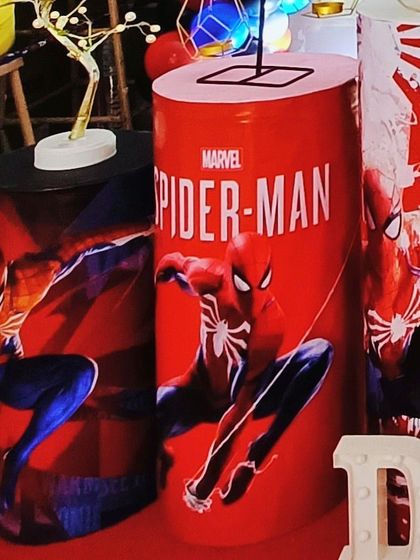 A close-up of the custom-printed plinths for the Spider-Man themed birthday party, showing the high-quality character graphics that bring the theme to life.