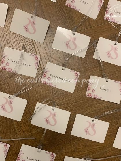 Seal your journey with love. These personalized luggage tags feature a custom wedding logo and guest names, making them a keepsake that travels with you.