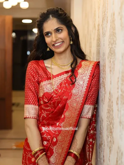 A happy and relaxed portrait of the bride-to-be. Her makeup is minimal and fresh, perfect for an engagement party, letting her natural beauty be the focus.