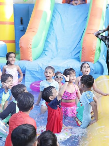 An entertainer gets all the kids excited for a pool game. I work with professional hosts who are experts at engaging children and leading the fun.
