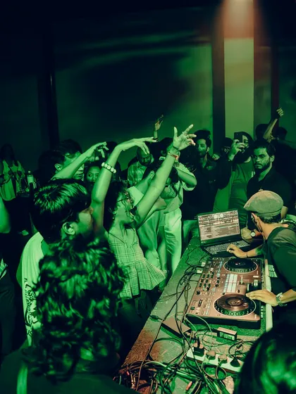 A wide shot of the dance floor from my perspective. It's an amazing feeling to see everyone moving to the beats I'm playing.