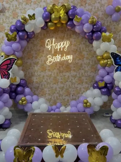 A direct shot of the butterfly ring setup, perfect for taking photos in front of. The table in the middle is ideal for placing the birthday cake.