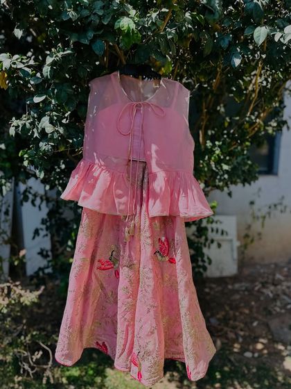This soft pink lehenga set with a peplum top and printed skirt is another one of my favorite designs. It’s comfortable, stylish, and perfect for any special occasion.