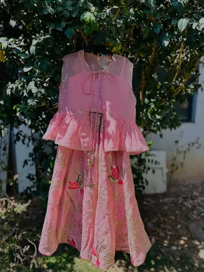 The pink peplum top lehenga. The soft color and delicate print make it a very sweet choice.
