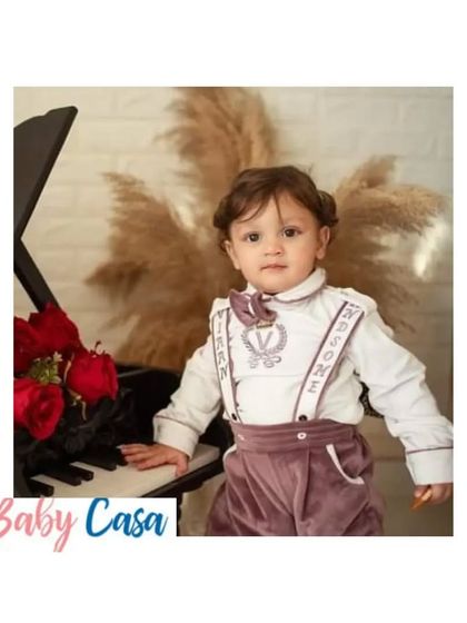 A handsome little pianist in our custom winter formal wear. This velvet suspender set is perfect for keeping him warm while looking sharp at a holiday party or family event.