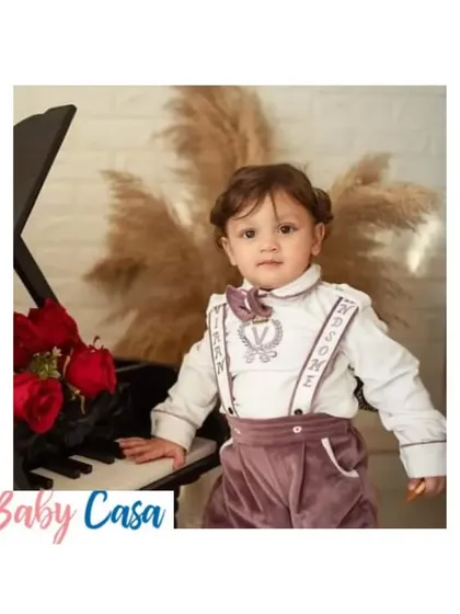 A handsome little pianist in our custom winter formal wear. This velvet suspender set is perfect for keeping him warm while looking sharp at a holiday party or family event.