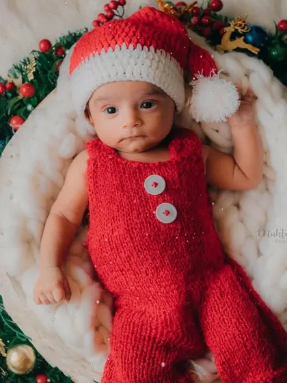 Lying in a Christmas wreath, this little one is the best present any family could ask for.
