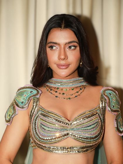 Another angle of this stunning glam look. The focus is on creating a perfect canvas so the client's natural beauty and unique outfit can shine.