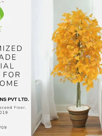 Customized handmade artificial plants for your home. This yellow-leafed tree adds a bright and cheerful touch to this living room, proving that greenery doesn't always have to be green.