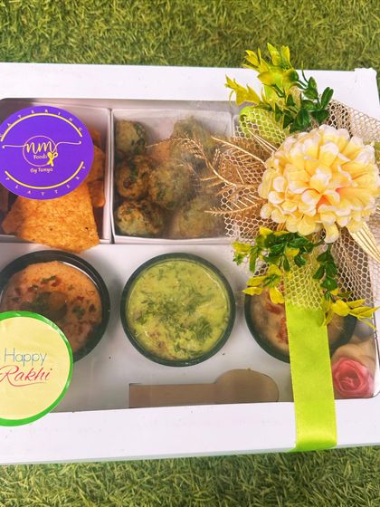 My Mezze Box, specially decorated for Rakhi. It contains falafel croquettes, three types of hummus and dips, herbed pita, and crackers.