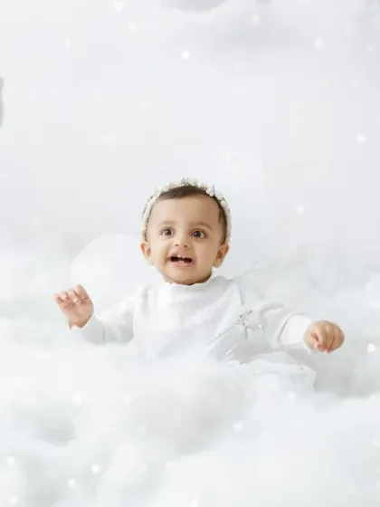 A happy fairy popping up from a sea of soft, white clouds. This theme is all about creating a light and ethereal atmosphere.