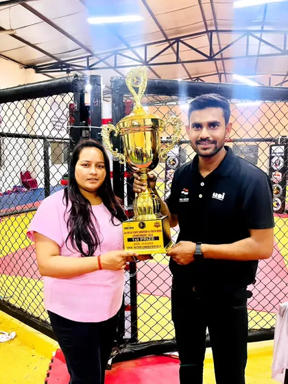Receiving the first prize trophy at the Delhi State MMA Championship. This win belongs to every single member of our club.