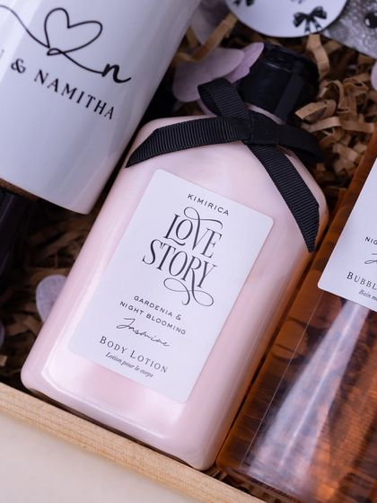 A close-up on the 'Love Story' body lotion, a central piece in my 'Beginning of Forever' hamper for newlyweds. The elegant packaging speaks to a romantic theme.