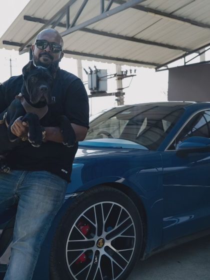 A portrait with my dog and a beautiful blue Taycan. The trust between a man and his dog is a special thing.