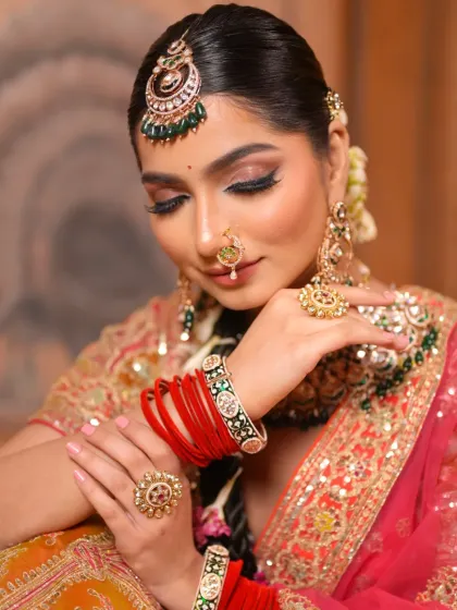 A beautiful close-up of the bride with her eyes closed, showcasing the intricate eye makeup. The blending is seamless, and the colors are rich and vibrant.