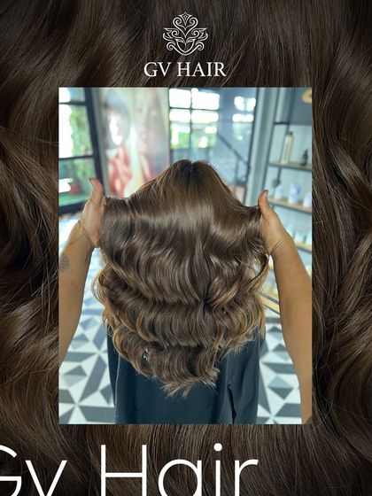 Color outside the lines. This deep chocolate brown, styled in bouncy waves, is full of volume and shine.