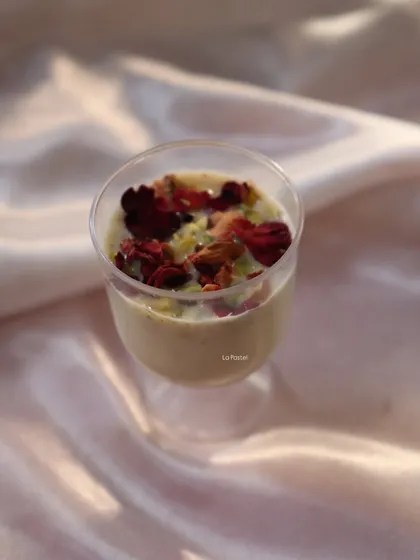 A single serving of my Holi special Thandai mousse, garnished with rose petals and pistachios.