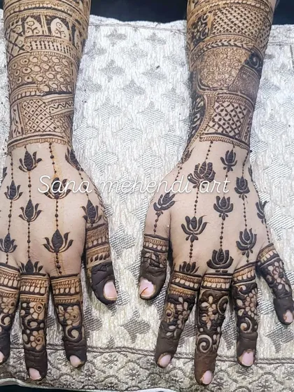 A closer look at the elegant lotus trail design on the back of the hands.