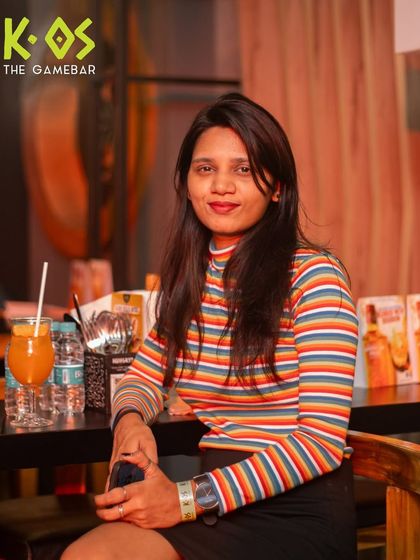 Chilling at the bar with a drink in hand. It's the perfect spot to catch up with friends or just soak in the energetic atmosphere of a night at K-OS.