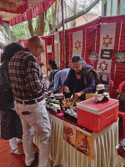 A happy moment with a customer at our stall. We always encourage people to try before they buy, so they can find the exact flavour they are looking for.