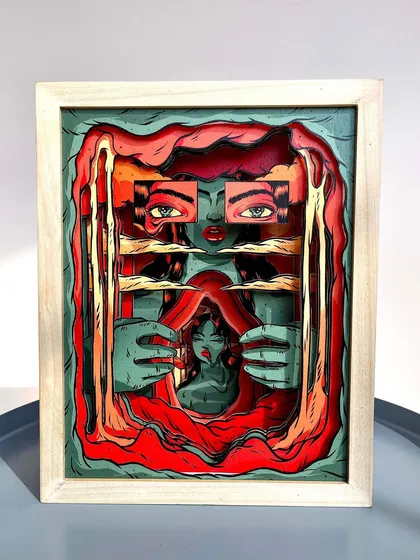 The final paper sculpture housed in a custom-made wooden box frame.