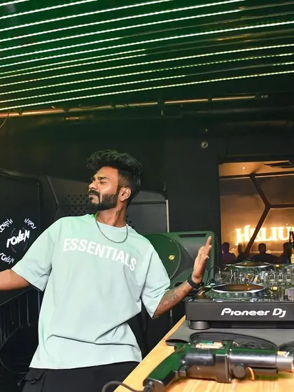 Posing behind the decks at Helium, Pune, in my 'Essentials' tee.