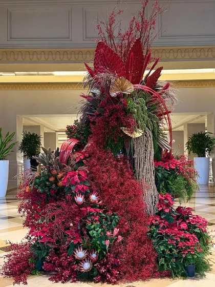 This angle shows the full, cascading form of the Christmas installation. My goal was to create a piece that felt like it was growing organically from the ground up, a true centerpiece for the hotel's holiday decor.