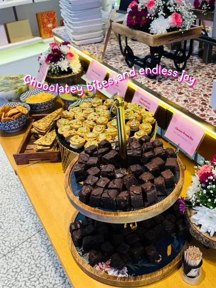 A glimpse of our elegant appetizer spread for a corporate event with Tira Beauty. We served delicious chocolatey brownie bites and savory mini tarts, proving that professional events can be full of fun flavors. Our presentation is designed to impress your guests from the first look.