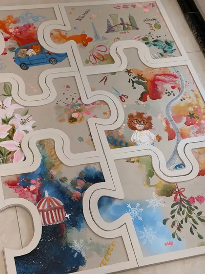 A detail shot of the puzzle artwork. You can see the different elements and stories woven together into a single, cohesive piece. It's a beautiful symbol of a shared life.