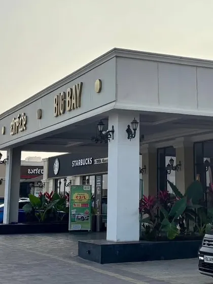 Another angle of our entrance area, with Starbucks visible, showcasing the clean, modern architecture and the presence of top international brands.