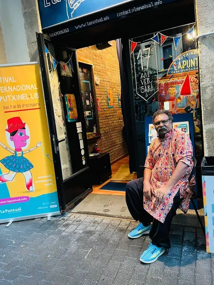 Sitting outside the La Puntual theatre in Barcelona before a show. We travel far and wide to find new audiences for our Kathputli art.