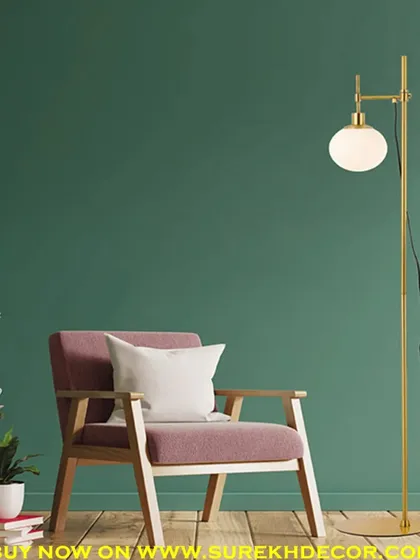 This contemporary floor lamp features a single glass globe on an adjustable golden stand. The minimalist design and elegant finish make it a versatile piece that can fit into any modern decor scheme.