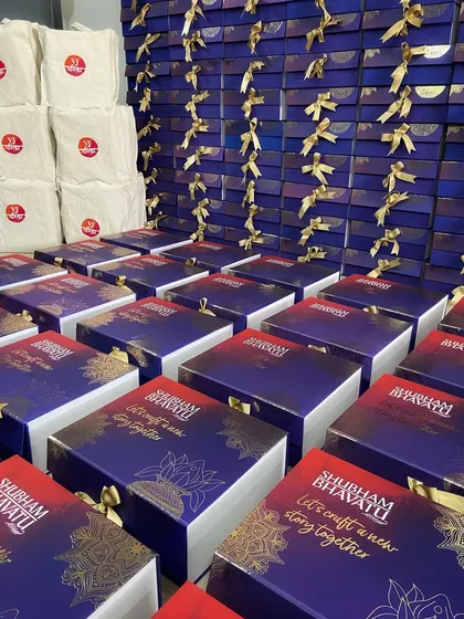 A sea of purple and gold. This large festive order showcases our capability to handle high-volume corporate gifting with custom-designed boxes and elegant packaging for a lasting impression.